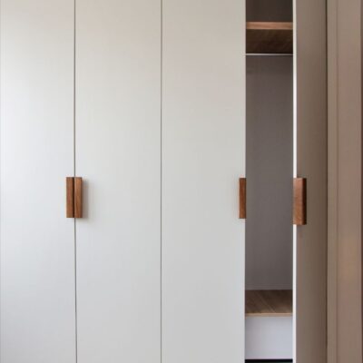 Wardrobe with wooden handles